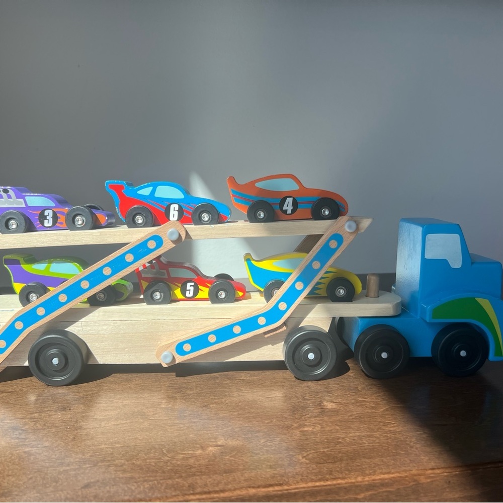 Melissa & Doug Mega Race-Car Carrier - Wooden Tractor and Trailer With 6 Unique
